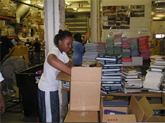 Volunteers sorting and packing books at the Books For Africa warehouse in St. Paul, Minnesota.