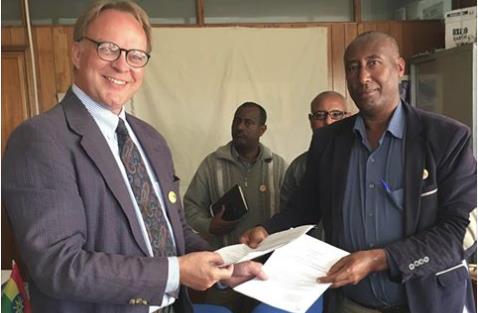 Plonski and EKTTS officials finalize the new partnership agreement