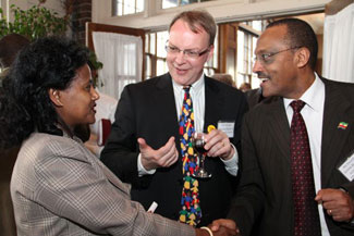 BFA Executive Director Patrick Plonski (center) introduces Ambassador Girma Birru Geda to Yeshi Tolessa, who is fundraising to send a BFA container of books to Ethiopia.