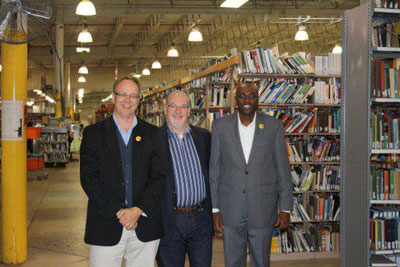 BFA Executive Director Pat Plonski, Better World Books CEO Andy Perlmutter, and BFA President Tom Gitaa touring the Better World Books warehouse in South Bend, Indiana.
