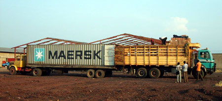 585 boxes of BFA books and refurbished computers were transferred from the sea container to the truck.