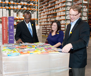 Viewing the books at the Capstone Publishers warehouse in Mankato, Minnesota, USA.