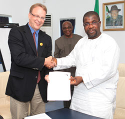 BFA Executive Director Pat Plonski shakes hands with Sir Emeka Offor in celebration of the $400,000 MOU which will send 32 containers of BFA books to Nigerian schools.