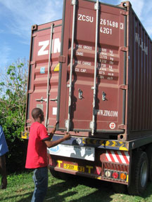 Unloading the 40-foot sea container of BFA books in Tanzania.