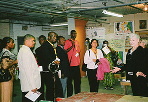BFA's Board Chair, Gena Doyscher speaking at Books For Africa's Warehouse
