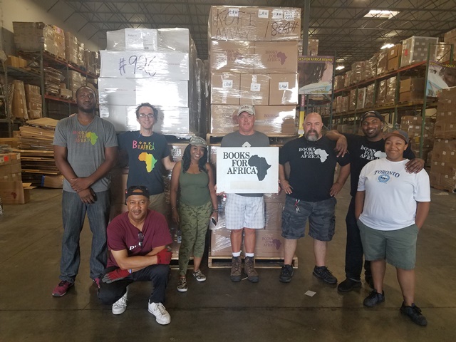 Pictured are Books For Africa staff in our Atlanta, Georgia warehouse loading this container of books for delivery to Liberia.